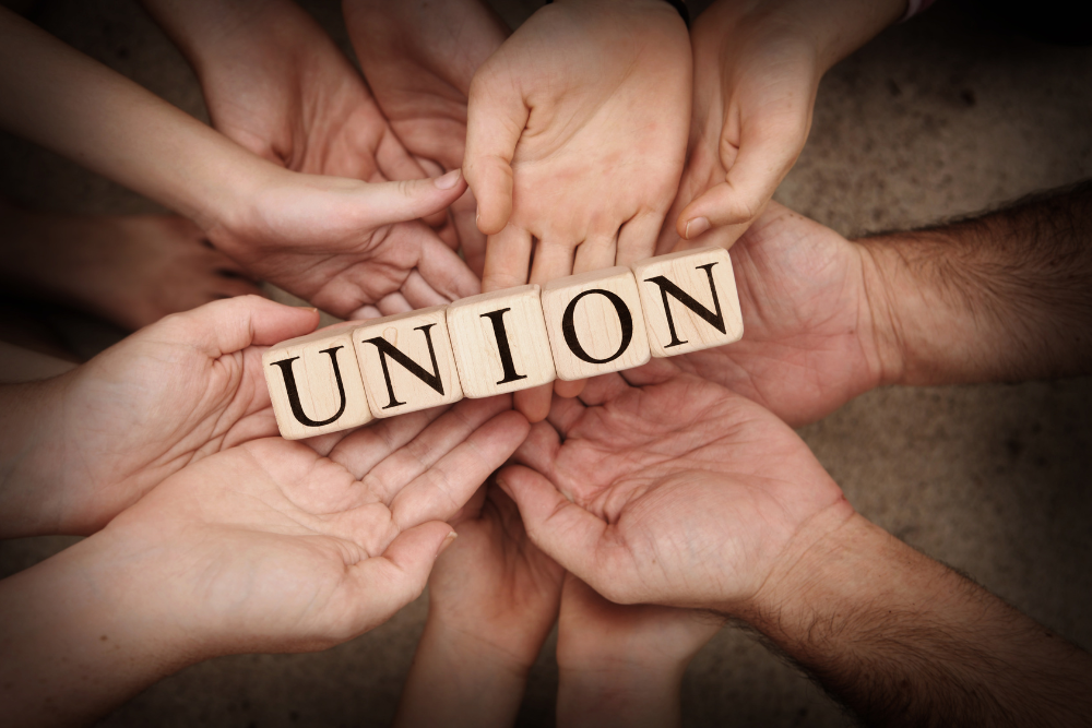 Lots of hands, Workers Union, Block with inscription